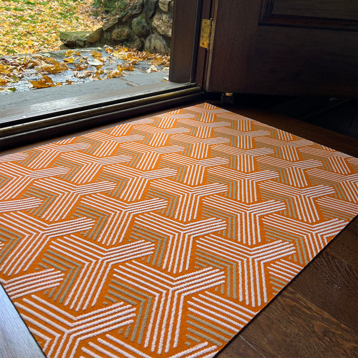 https://www.porteandhall.com/cdn/shop/products/2_Indoor-Mat-Insider-Retro-Orange-Doormat.jpg?v=1677553886